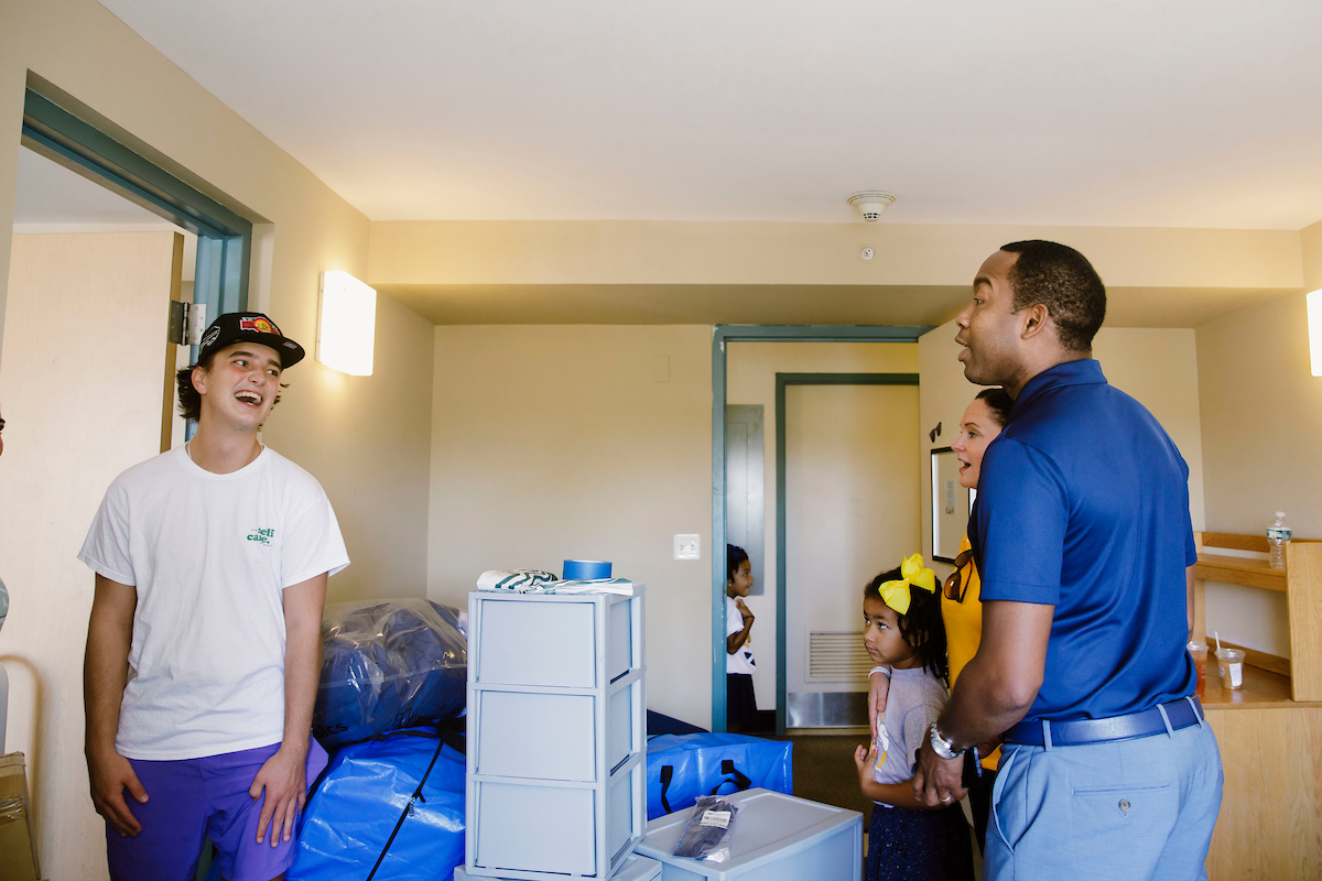 President Stoute helping students move into the residence halls