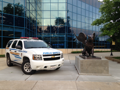 Public Safety vehicle next to Griffin statue